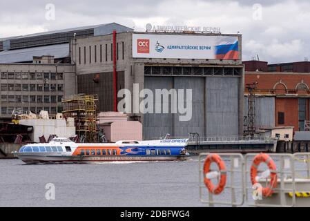 Saint-Petersburg, Russia – August 11, 2020: Hydrofoil tour boat sails past The Admiralty Shipyard Stock Photo