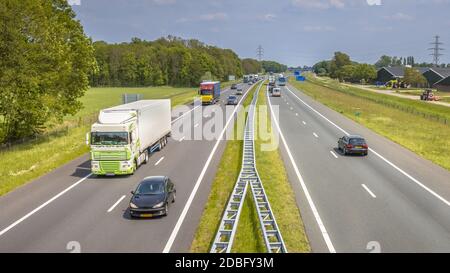 Motor Traffic on the A1 Motorway seen from above. This is one of the Bussiest highways in the Netherlands Stock Photo