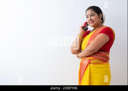 Kuchipudi dancer smiling while talking on call Stock Photo