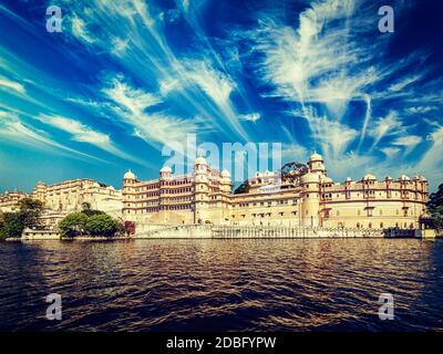 Vintage retro effect filtered hipster style image of City Palace view from the lake. Udaipur, Rajasthan, India Stock Photo