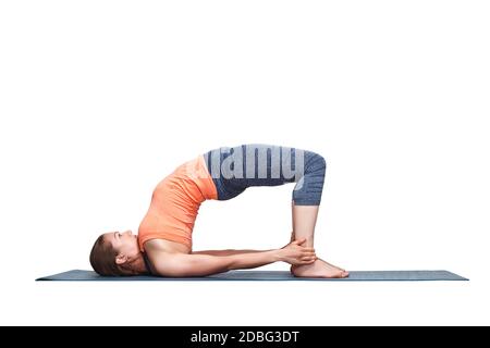 Young man doing yoga or pilates exercise in urban background. Advanced  Bridge pose, chakrasana. Stock Photo | Adobe Stock