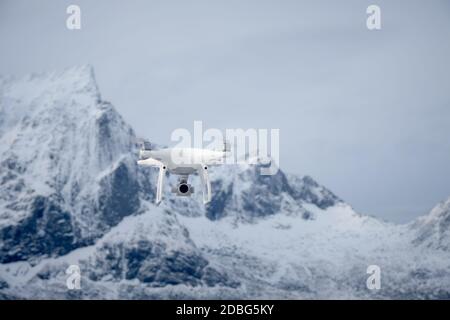 Quadcopter drone with digital camera in mountains Stock Photo