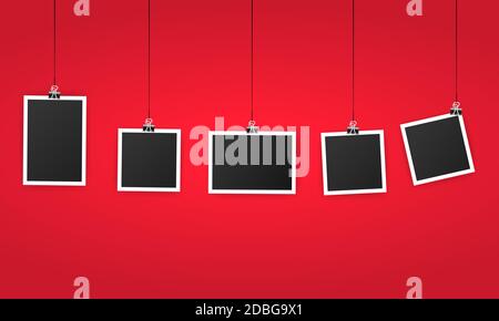 An empty photo frame set hanging on a clip. Black blank space for text or photo. Realistic photo icon design template. Vector on isolated background Stock Vector