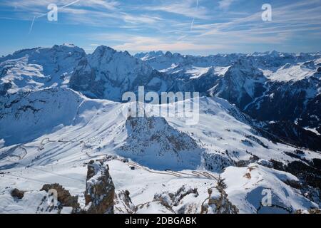 View of a ski resort piste and Dolomites mountains in Italy from Passo Pordoi pass. Arabba, Italy Stock Photo