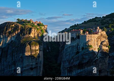 Monastery of Varlaam and Great Meteoron Monastery in famous greek tourist destination Meteora in Greece on sunrise. Horizontal camera pan Stock Photo