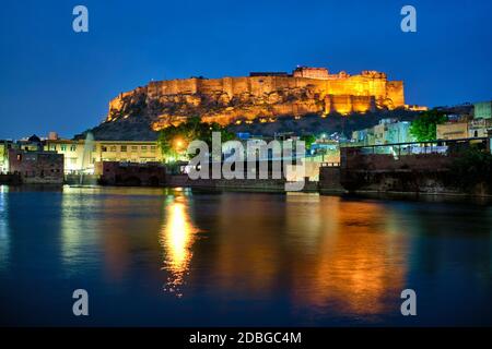 Black and White Picture/Photo: Couple walking below gate and high walls,  Mehrangarh Fort. Jodhpur, Rajasthan, India