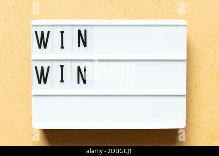 Lightbox with word win win on wood background Stock Photo
