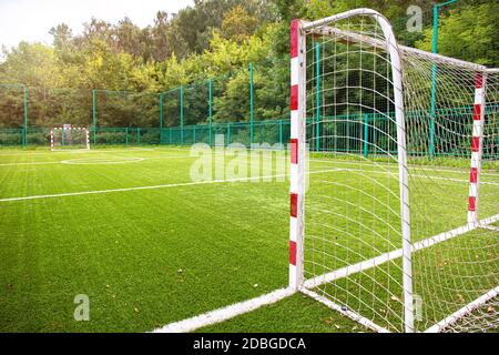 Training soccer field with green turf. Football field with goals and markings or side lines. Stock Photo