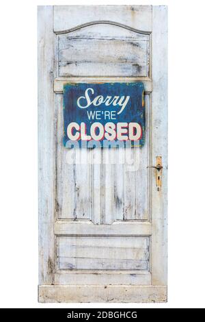 Weathered wooden door with sorry we are closed sign Stock Photo