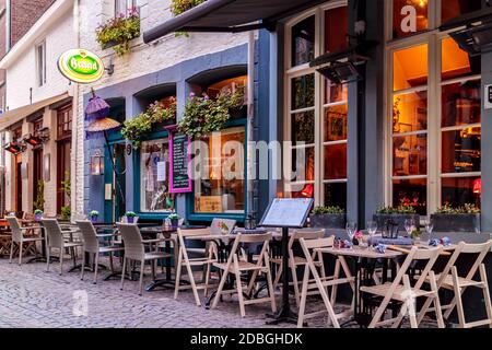MAASTRICHT, THE NETHERLANDS - NOVEMBER 22, 2016: Evening view of empty dinner tables in front of restaurants in Maastricht, The Netherlands Stock Photo