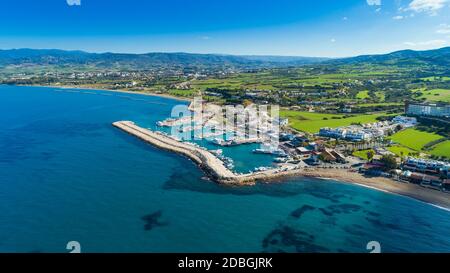 Aerial bird's eye view of Latchi port, Akamas peninsula, Polis Chrysochous, Paphos, Cyprus. The Latsi harbour with boats and yachts, fish restaurants, Stock Photo