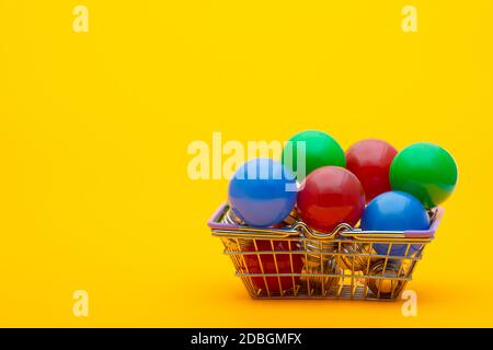 red, blue and green light bulbs in the consumer basket Stock Photo