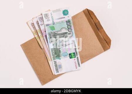 Paper money of the Russian Federation. A stack of banknotes for payments of pensions, wages, benefits and other social benefits.