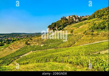 Chateau-Chalon village above its vineyards in Jura, France Stock Photo