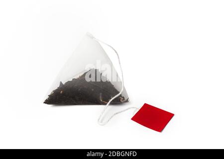 Pyramid shape teabag close up isolated on the white background Stock Photo