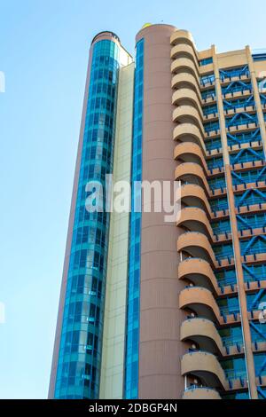 Bottom view of modern building. Skyscraper in sunny day Stock Photo
