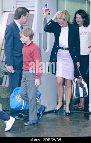 HRH Princess Diana and a young Prince William arriving at London Heathrow Airport January 1993 Stock Photo