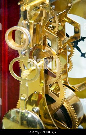 Close up shot of golden clock gears Stock Photo