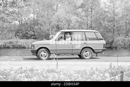 Prince Andrew and Sarah Ferguson driving in Windsor Park Stock Photo