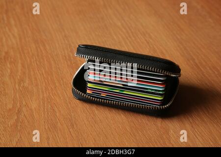 Loyalty cards in a zip up wallet. Stock Photo