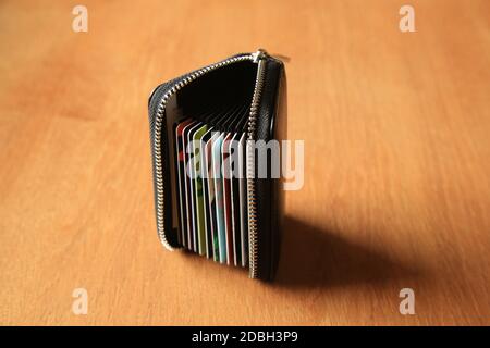 Loyalty cards in a zip up wallet. Stock Photo