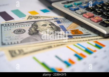 Saving stack coins money, Calculator, Charts and Graphs spreadsheet paper. Finance, Account, Statistics, Analytic research data and Business company m Stock Photo