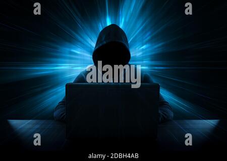 Male thief stealing data from computer - Cyber Crime Concept Stock Photo
