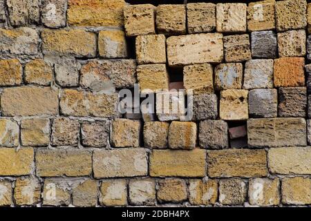 a shadow from the blocks of limestone shell. Wall texture background Stock Photo