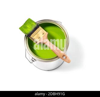 Green paint tin can with brush on top on a white background Stock Photo