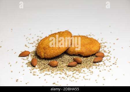 almonds (without shell) and sesame, homemade cookies, white backgrou Stock Photo