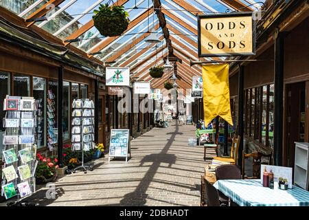 Interior of Great Torrington Pannier Market, Shops and Glass Roof Detail Looking Towards the Main Town Entrance and Torrington Square Stock Photo