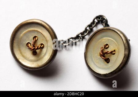 Old shirt cufflinks on white background Stock Photo