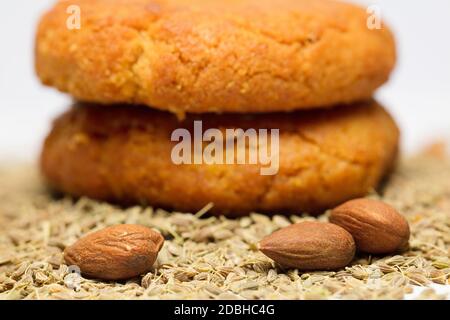 almonds (without shell) and sesame, homemade cookies, white background Stock Photo