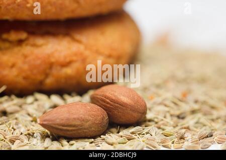almonds (without shell) and sesame, homemade cookies, white background Stock Photo