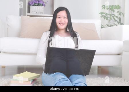 Young modern woman working from home, using laptop during coronavirus pandemic time. Stock Photo