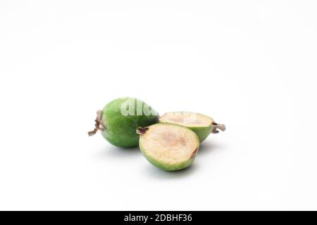 Fresh ripe feijoa isolated on white background. Tropical fruit. Cut feijoa. Stock Photo