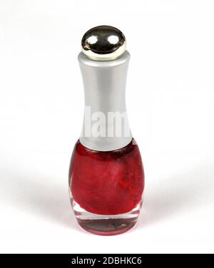 Red color nail polish bottle on white background Stock Photo