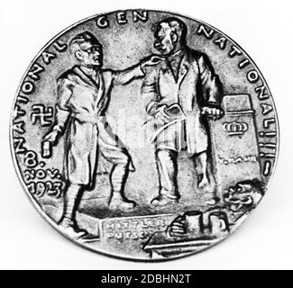 The coin dealer Karl Kress destroyed all attainable mintages of this medal after the NSDAP came to power in 1933. The Beer Hall Putsch - Hitler with Kahr in the Buergerbraeukeller - seen as a Punch and Judy show. Stock Photo