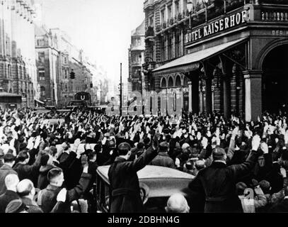 A crowd greets the newly appointed Reich Chancellor Adolf Hitler after his appointment by Paul von Hindenburg upon his return to his accommodation. Stock Photo