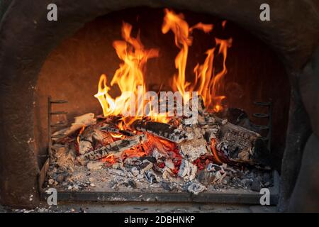 Wood burning in empty barbecue grill Stock Photo