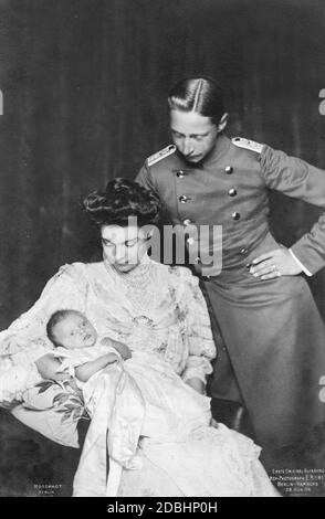 The photograph shows the young Crown Prince Wilhelm of Prussia and Crown Princess Cecilie of Mecklenburg at the christening of their first son, Prince Wilhelm of Prussia, in 1906. The photograph was taken by court photographer E. Bieber from Berlin. Stock Photo