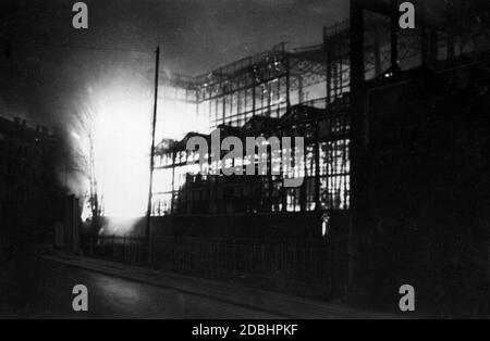 Burning of the Munich Glaspalast. On the night of June 6, 1931, the palace burned down completely. Only the steel framework of the building is recognizable here. Stock Photo