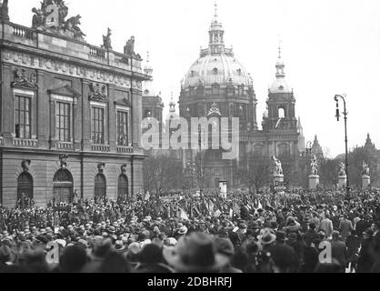 The photograph from 1933 shows a parade of the Reichswehr, which is watched by a large crowd. The soldiers march across the street Unter den Linden in Berlin to the field service in the Schlueterhof of the Berlin Palace. On the left is the Zeughaus, in the background the Berlin Cathedral. Stock Photo