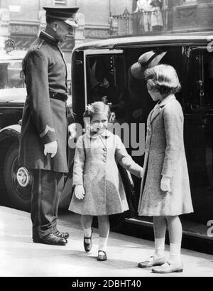 Princess Margaret (middle) and Princess Elizabeth upon their arrival at the Olympia Grand Hall for the opening ceremony of the Royal Tournaments. Stock Photo