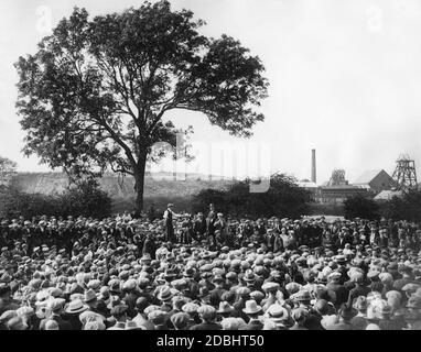 Workers are gathered in front of a mine. (undated photo) Stock Photo