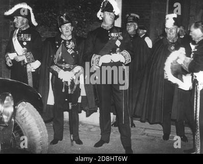 Members of the English Pivy Council, who had previously decided on the accession of Edward VIII to the throne, make their way to St. James Palace. 2nd from left is David Richard Beatty, 1st Earl Beatty. Stock Photo