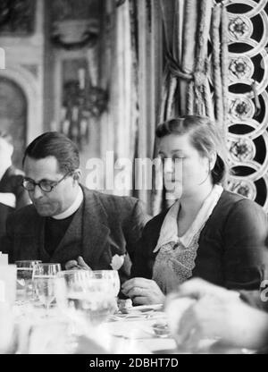 An unemployed couple is invited by the Peace Pledge Union to lunch at the Ritz Hotel in London. Stock Photo