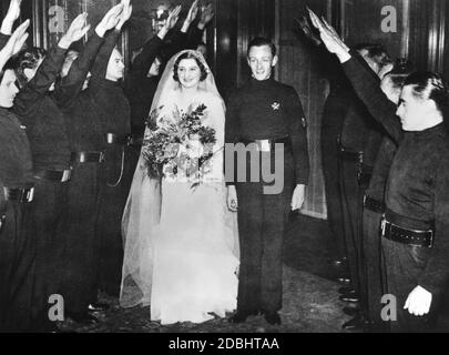 Wedding of Ian Hope Dundas, Chief of Staff of the British Union of Fascists (BUF), and Pamela Ernestine Dorman at St. Michael's Church in London. The couple leaves the church after the wedding ceremony through an honor guard of party members. Stock Photo