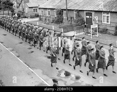 Uniformed members of the Women's War Service Auxiliary march during a training session. This troop supports the Royal Air Force in the domestic air defense. Stock Photo