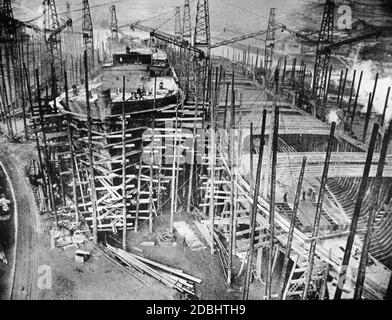 Construction of a ship in dry dock in an English shipyard. Stock Photo